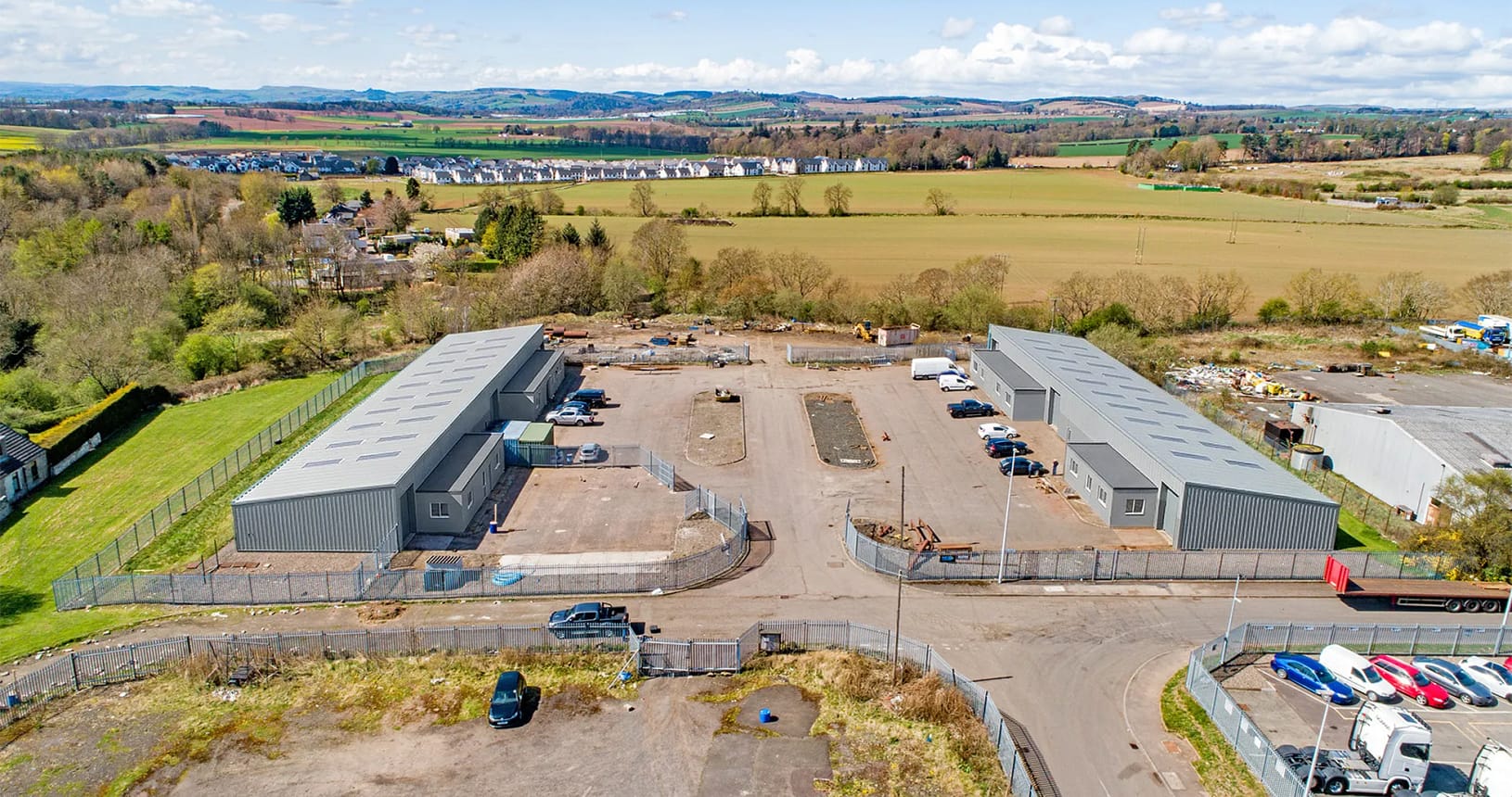 Aerial view of Blocks 11 and 12 at Wester Gourdie Industrial Estate in Dundee showing refurbished industrial units and secure yard