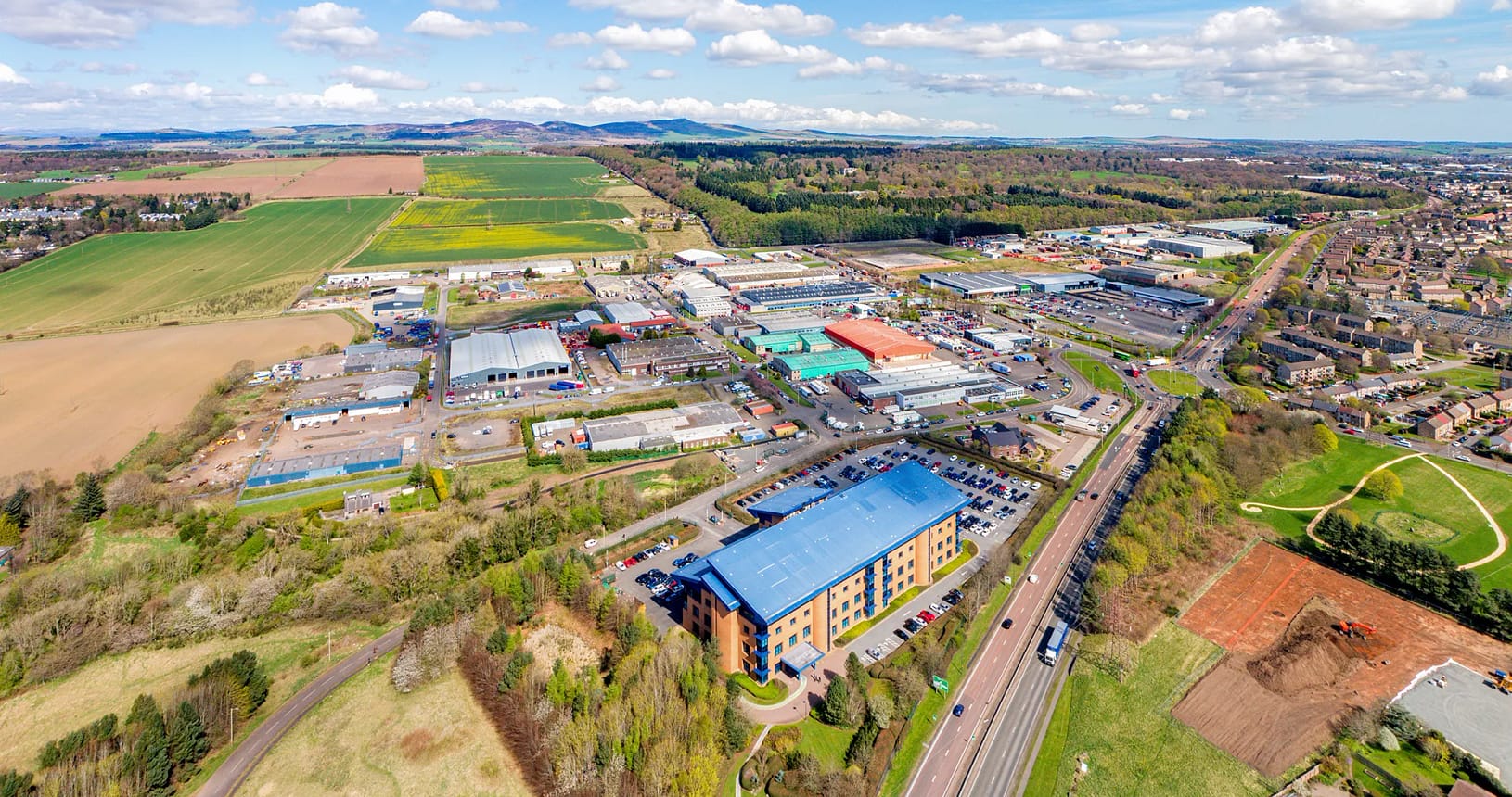 Wester Gourdie Industrial Estate in Dundee - Aerial image showing A90 Kingsway and surrounding industrial units