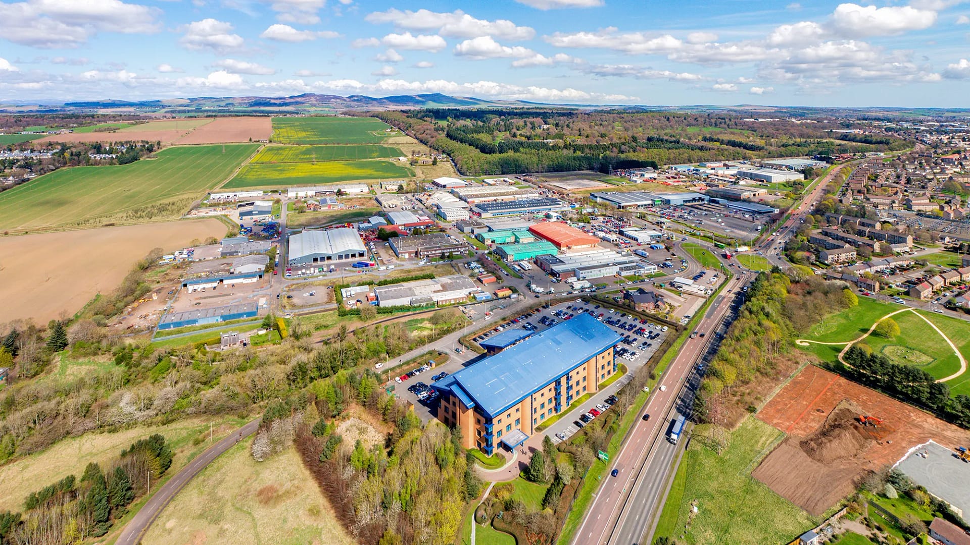 Wester Gourdie Industrial Estate in Dundee - Aerial image showing A90 Kingsway and surrounding industrial units